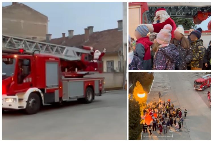 Bucurie pentru cei mici! Moșul a ajuns la Cluj cu autospeciala, nu cu sania! Micuții au colindat și au fost răsplătiți pe măsură - VIDEO